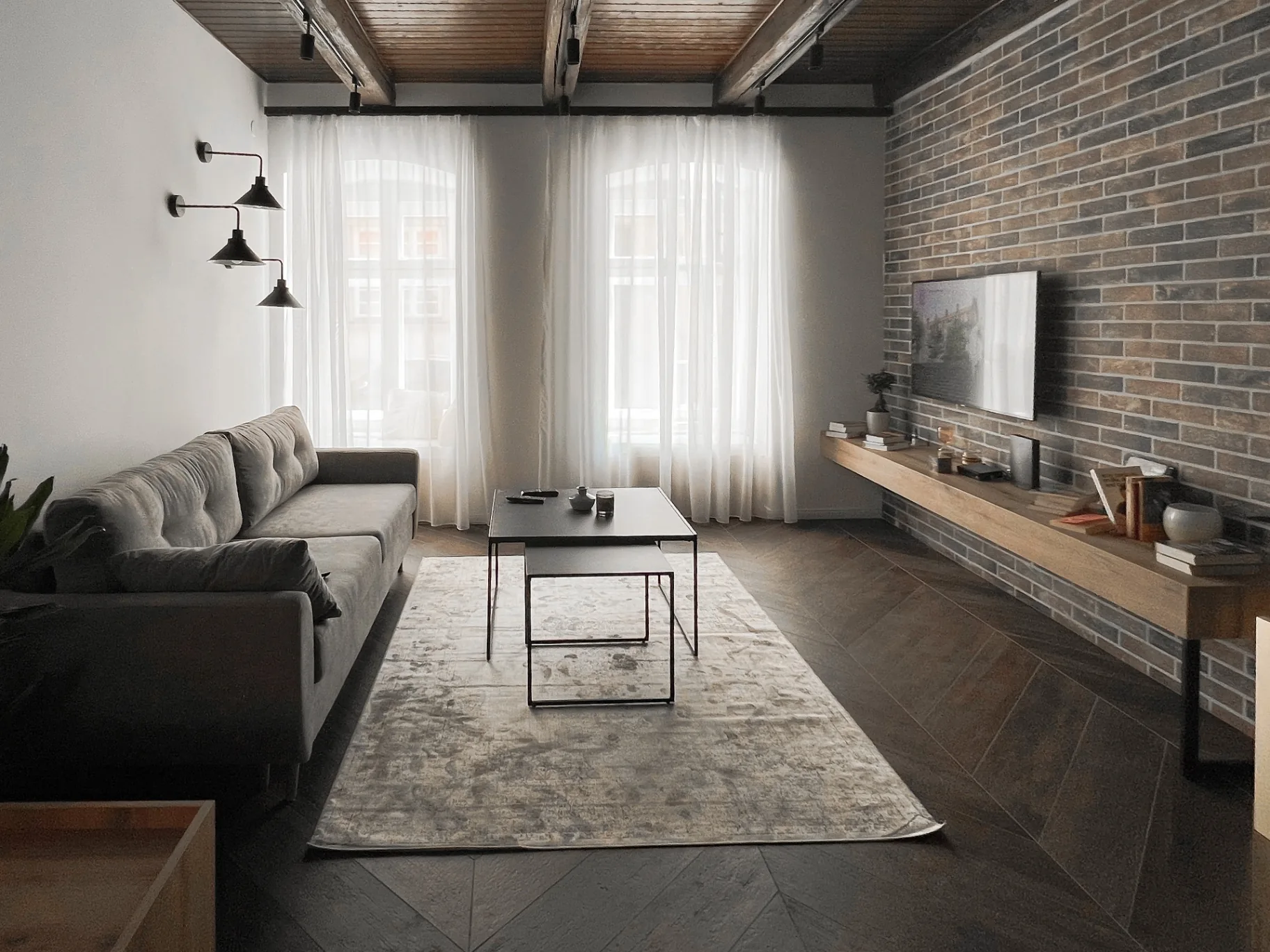 Lower level of the loft with wooden staircase